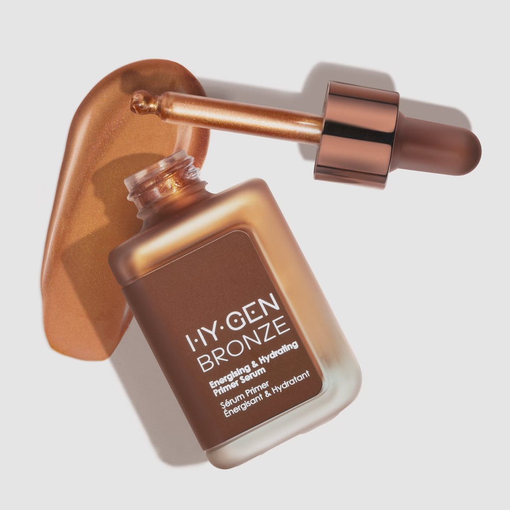 168极速一分钟赛车开奖 HY-GEN BRONZE Energizing & Hydrating Primer Serum with dropper and bronze liquid smear on white background